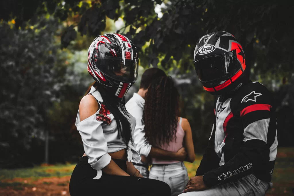 couple riding a motorcycle during a photoshoot