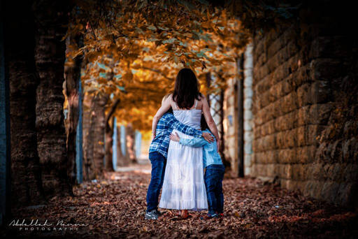 a mother and two daughters posing for a family photoshoot