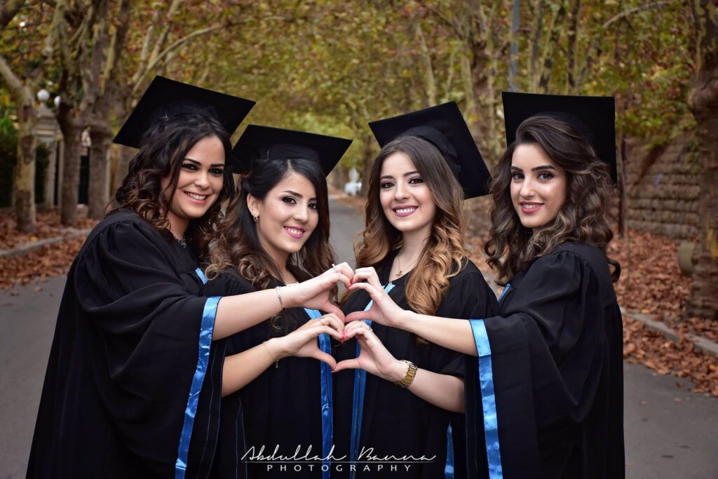 Graduation photography 4 women standing together in graduation outfits