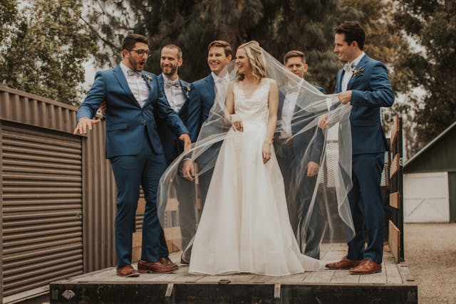 A group shot with the groomsmen, whether they are laughing, walking, or striking a more formal pose, adds character and fun to the album.