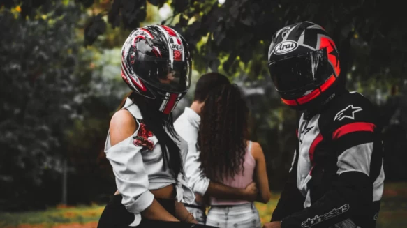couple riding a motorcycle during a photoshoot